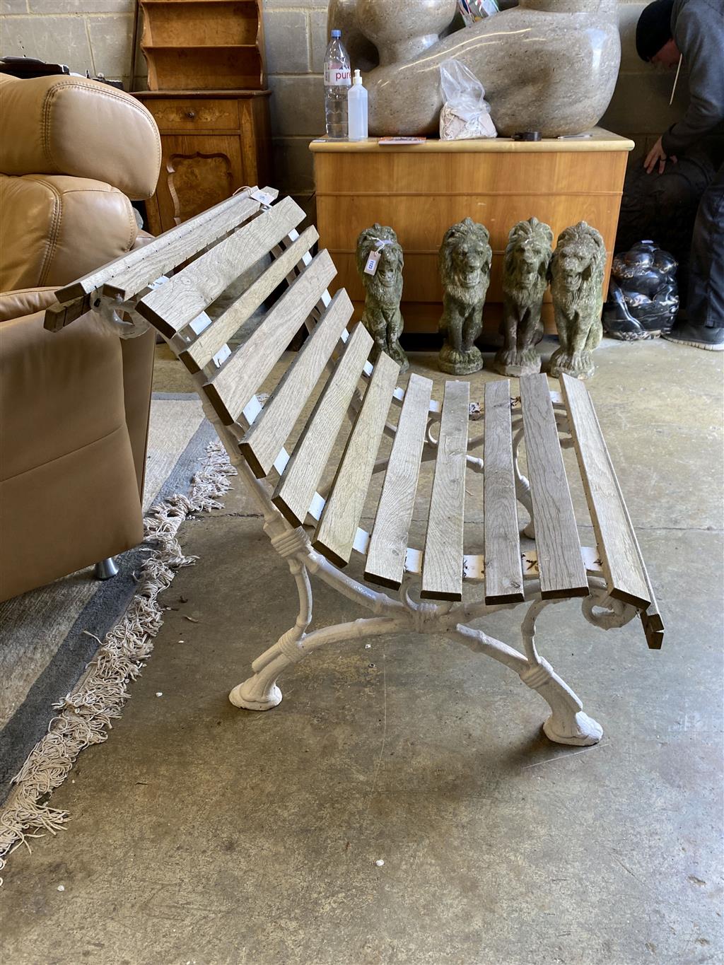 A small slatted cast iron garden bench, length 76cm, depth 80cm, height 75cm